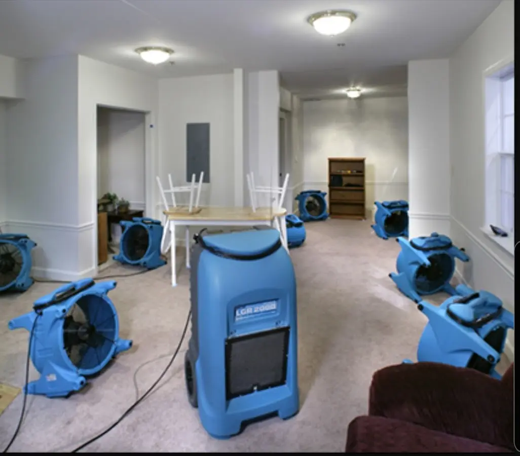 Air movers and dehumidifier setup for Water Damage Restoration in Spout Springs